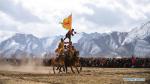 Feb.27,2018--Players perform on horseback in an equestrian event in Jiangjiao Village of Lhasa, capital of southwest China`s Tibet Autonomous Region, Feb. 25, 2018. (Xinhua/Jigme Dorje)