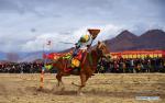 Feb.27,2018--A player performs on horseback in an equestrian event in Jiangjiao Village of Lhasa, capital of southwest China`s Tibet Autonomous Region, Feb. 25, 2018. (Xinhua/Jigme Dorje)