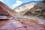 Mar. 14, 2018 -- This photo taken on March 11, 2018 shows saline fields in Mangkam County of Qamdo, southwest China`s Tibet Autonomous Region. Local salt farmers have followed a centuries-old harvesting method by collecting brines from the rocks and drying them in prepared fields until the salt within crystalizes. (Xinhua/Jigme Dorgi)