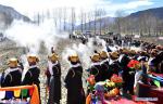 Mar. 19, 2018 -- Farmers toss Tsamba flour into the air during a spring ploughing ceremony in a village in Nedong District of Shannan, southwest China`s Tibet Autonomous Region, March 17, 2018. Traditional spring ploughing ceremonies took place in Tibet`s major cultivation areas on Saturday to pray for a year with good harvests.(Xinhua/Chogo)