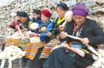 Mar. 23, 2018 -- Women of the Langersa Traditional Handcraft Development Limited Company in Bainang County, Shigatse City are twisting woolen yarn. [China Tibet News/Chen Lin,Zhang Bin,Tashi Dhondup,Chu Wugan]