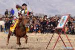 Mar. 29, 2018 -- A player shoots an arrow on horseback in an equestrian event in Jiangjiao Village of Lhasa, capital of southwest China`s Tibet Autonomous Region, Feb. 25, 2018. (Xinhua/Chogo)