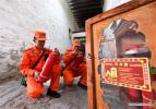 April 4, 2018 -- Firefighters check fire extinguishers during an emergency drill at the Potala Palace in Lhasa, southwest China`s Tibet Autonomous Region, April 2, 2018. (Xinhua/Jigme Dorgi)