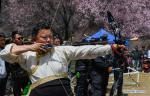 April 17, 2018 -- A man takes part in a competition during a kick-off ceremony for tourism season in Gongbo`gyamda County, southwest China`s Tibet Autonomous Region, April 15, 2018. (Xinhua/Liu Dongjun)