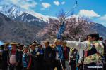 April 17, 2018 -- People take part in a competition during a kick-off ceremony for tourism season in Gongbo`gyamda County, southwest China`s Tibet Autonomous Region, April 15, 2018. (Xinhua/Liu Dongjun)