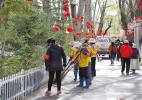 April 26, 2018 -- Sanitation workers are cleaning the road of the Dzongyab Lukhang Park. [China Tibet News/Losang]