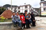 May 12, 2018 -- Villager Li Shide (4th L) poses for a group photo with children and another old man in Gan`en Village of Longnan City, northwest China`s Gansu Province, May 9, 2018. Gan`en Village is a new village built to relocate villagers of Haoping Village, which was badly damaged by the 8.0-magnitude 2008 Wenchuan earthquake in neighboring Sichuan Province. The village was named `Gan`en` at the end of 2008 to express gratitude for the reconstruction efforts. After ten years of hard work, Gan`en Village has regained life. (Xinhua/Fan Peishen)