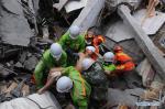 May 12, 2018 -- File photo taken on May 17, 2008 shows rescuers carrying Jiang Yuhang, who was trapped for about 123 hours in the rubble, at quake-hit Yingxiu Township of Wenchuan County, southwest China`s Sichuan Province. The 20-year-old highway administration employee was extricated by firemen from Shanghai, after an 8.0-magnitude earthquake struck Wenchuan on May 12, 2008. Jiang was a survivor of the earthquake which left more than 69,000 dead, 374,000 injured, 18,000 missing and millions homeless. Jiang said it were firefighters who gave him the second life, and he desired to be a soldier like them. At the end of 2008, Jiang realized his dream to join the army and served in the group who once saved him. After training for half a year, he finally became a real fire soldier in Shanghai in 2009. Jiang later got promoted to the position of an officer, and in March this year, he was transferred to the firefighting force in his hometown Kaili City, southwest China`s Guizhou Province. In the past ten years, the young man, who was saved in that catastrophic earthquake, saved more people`s lives with his own efforts. (Xinhua/Jiang Hongjing)