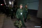 May 12, 2018 -- File photo taken on Dec. 12, 2008 shows Jiang Yuhang, as a new recruit, arriving at the Shanghai Railway Station in Shanghai, east China. On May 17, 2008, Jiang, a 20-year-old highway administration employee, was extricated by firefighters, 123 hours after he was trapped in the rubble at quake-hit Yingxiu Township of Wenchuan County, southwest China`s Sichuan Province. Jiang was a survivor of the 8.0-magnitude earthquake that struck Sichuan`s Wenchuan County on May 12, 2008. The quake left more than 69,000 dead, 374,000 injured, 18,000 missing and millions homeless. Jiang said it were firefighters who gave him the second life, and he desired to be a soldier like them. At the end of 2008, Jiang realized his dream to join the army and served in the group who once saved him. After training for half a year, he finally became a real fire soldier in Shanghai in 2009. Jiang later got promoted to the position of an officer, and in March this year, he was transferred to the firefighting force in his hometown Kaili City, southwest China`s Guizhou Province. In the past ten years, the young man, who was saved in that catastrophic earthquake, saved more people`s lives with his own efforts. (Xinhua/Zhao Yun)