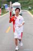 May 12, 2018 -- File photo taken on June 13, 2008 shows torchbearer Jiang Yuhang running with the torch during the Beijing Olympic Games torch relay in Kaili City, southwest China`s Guizhou Province. On May 17, 2008, Jiang, a 20-year-old highway administration employee, was extricated by firefighters, 123 hours after he was trapped in the rubble at quake-hit Yingxiu Township of Wenchuan County, southwest China`s Sichuan Province. Jiang was a survivor of the 8.0-magnitude earthquake that struck Sichuan`s Wenchuan County on May 12, 2008. The quake left more than 69,000 dead, 374,000 injured, 18,000 missing and millions homeless. Jiang said it were firefighters who gave him the second life, and he desired to be a soldier like them. At the end of 2008, Jiang realized his dream to join the army and served in the group who once saved him. After training for half a year, he finally became a real fire soldier in Shanghai in 2009. Jiang later got promoted to the position of an officer, and in March this year, he was transferred to the firefighting force in his hometown Kaili City, southwest China`s Guizhou Province. In the past ten years, the young man, who was saved in that catastrophic earthquake, saved more people`s lives with his own efforts. (Xinhua/Xing Guangli)