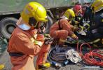 May 12, 2018 -- File photo taken on Feb. 5, 2018 shows Jiang Yuhang (1st L) taking part in a rescue mission at a traffic accident site in Shanghai, east China. On May 17, 2008, Jiang, a 20-year-old highway administration employee, was extricated by firefighters, 123 hours after he was trapped in the rubble at quake-hit Yingxiu Township of Wenchuan County, southwest China`s Sichuan Province. Jiang was a survivor of the 8.0-magnitude earthquake that struck Sichuan`s Wenchuan County on May 12, 2008. The quake left more than 69,000 dead, 374,000 injured, 18,000 missing and millions homeless. Jiang said it were firefighters who gave him the second life, and he desired to be a soldier like them. At the end of 2008, Jiang realized his dream to join the army and served in the group who once saved him. After training for half a year, he finally became a real fire soldier in Shanghai in 2009. Jiang later got promoted to the position of an officer, and in March this year, he was transferred to the firefighting force in his hometown Kaili City, southwest China`s Guizhou Province. In the past ten years, the young man, who was saved in that catastrophic earthquake, saved more people`s lives with his own efforts. (Xinhua)