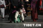 May 29,2018--Buddhists prostrate around Barkhor Street.