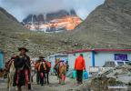 June 29,2018--People walk on the foot of the Mount Kangrinboqe in Burang County of Ngari Prefecture, southwest China`s Tibet Autonomous Region, June 25, 2018. (Xinhua/Liu Dongjun)