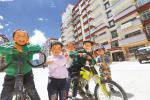 July 11,2018--Photo shows children from relocated families playing games happily at their new housing courtyard in Gartse District. [China Tibet News/ Tang Bin, Tsewang]