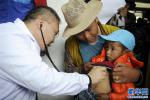 July 25,2018--On July 11th, `The Angel`s Tour: Screening for Congenital Heart Disease for Impoverished Children in Tibet` formally launched. A team of experts held a week-long public screenings in Nagqu and Lhasa. The event screened around 300 impoverished kids with congenital heart disease, and anyone who met surgery requirements could go to the Cardiovascular Hospital of Zhengzhou City in central China for free surgeries and treatment.[Photo/Xinhua]