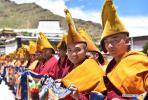 July 30,2018--Buddhist monks wait in line for the arrival of the 11th Panchen Lama Bainqen Erdini Qoigyijabu in Tashilumpo Monastery in Xigaze, southwest China`s Tibet Autonomous Region, July 27, 2018. The Panchen Lama returned to Tashilumpo Monastery in Xigaze on Friday after a series of Buddhist and social activities in Lhasa. (Xinhua/Chogo)