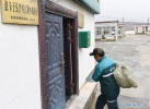 July 31,2018--Postal courier Cering Quba carries a bag of mails to the township branch of China Post in Pumaqangtang Township of Nagarze County in Shannan, southwest China`s Tibet Autonomous Region, July 23, 2018. In Pumaqantang Township, the highest township in China, working as a postal service staff means delivering mails to addresses at altitudes of 5,000 meters and above. Gesang Cering, 29, is a motorbike courier with the local township branch of China Post. Twice a week, Gesang calls on the plateau villages under the township on a 160-km route, coping with extreme oxygen and temperature conditions. Despite its harsh geography, Tibet Autonomous Region has substantially improved the local postal service over the four decades since China`s reform and opening up. By the end of 2017, the postal road network had managed to cover all towns and counties within the autonomous region. (Xinhua/Li He)