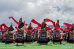 Aug.10,2018--Herdsmen dance during a performance in the opening ceremony of a horse racing festival in Damxung County, southwest China`s Tibet Autonomous Region, Aug. 8, 2018. Dangjiren horse racing is originated from military parade of Mongolian cavalry since 17th century. (Xinhua/Cen Yunpeng)