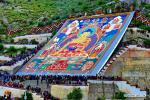 Aug.13,2018--Photo shows the scene of the traditional `sunning of the Buddha` ceremony at Drepung Monastery in Lhasa, capital of southwest China`s Tibet Autonomous Region, Aug. 11, 2018. Celebrations for the traditional Shoton Festival, or Yogurt Festival, began in Lhasa on Saturday. This year`s event will feature the traditional `sunning of the Buddha` ceremonies, with huge Thangka paintings bearing the image of the Buddha displayed on the hillsides near the Drepung and Sera monasteries, as well as Tibetan opera performances, horse riding performances and an ethnic costume show. (Xinhua/Zhang Rufeng)