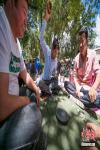 Aug.17,2018--On August 12, Tibetans picnic inside the Norbulingka Summer Palace and play sho, a Tibetan dice game. 