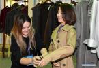 Sept. 10, 2018 -- A woman tries on a wind coat during the Fourth China Tibet Tourism and Culture Expo in Lhasa, capital of southwest China`s Tibet Autonomous Region, Sept. 8, 2018. The five-day expo will last untill Sept. 11. (Xinhua/Chogo)