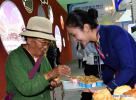 Sept. 10, 2018 -- A visitor tastes the dessert during the Fourth China Tibet Tourism and Culture Expo in Lhasa, capital of southwest China`s Tibet Autonomous Region, Sept. 8, 2018. The five-day expo will last untill Sept. 11. (Xinhua/Chogo)