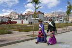 Sept. 19, 2018 -- Two villagers walk in a street in Jaggang Village of Rutog County, Ali Prefecture, southwest China`s Tibet Autonomous Region, Sept. 17, 2018. Located at 4,400 meters above sea level, the plateau village is a model unit in Ali Prefecture`s border-area poverty relief campaign. While still under construction, the village has managed to provide its current residents with access to water, electricity and network. Jaggang Village is also developing a collective economy which stresses building material manufacturing, border trade, plant nursery and local husbandry, so that the residents are prepared with working skills in addition to government subsidies. (Xinhua/Liu Dongjun)