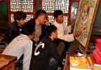 Sept. 21, 2018 -- Xerab Qiujiu (1st R) teaches students Tangka painting skills in Gyanmda County of Qamdo, southwest China`s Tibet Autonomous Region, Sept. 19, 2018. The Qiujiu Tangka Cooperative, founded by Xerab Qiujiu, an heir to the Tangka painting art in Kargang Town of Gyanmda County, has recruited more than 40 children from impoverished families since 2014 to help them grasp a skill in getting rid of poverty. (Xinhua/Zhang Rufeng)