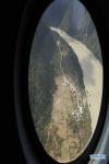 Oct. 19, 2018 -- Aerial photo taken on Oct. 18, 2018 shows the Jiala Village threatened by the landslide-caused barrier lake on the Yarlung Tsangpo River in Menling County, southwest China`s Tibet Autonomous Region. More than 6,000 people have been evacuated after a barrier lake formed following a landslide in the Yarlung Tsangpo River in southwest China`s Tibet Autonomous Region, local authorities said Thursday. According to the local disaster relief headquarters, the landslide struck during the early hours of Wednesday near a village in Menling County, blocking the river`s waterway. The amounts of water in the lake has surpassed 300 million cubic meters. No casualties have been reported. Authorities in Tibet have launched an emergency response, monitoring the lake`s water level, evacuating local residents and sending relief supplies to the disaster-hit areas. (Xinhua/Purbu Zhaxi)