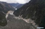 Oct. 19, 2018 -- Aerial photo taken on Oct. 18, 2018 shows the landslide body blocking the Yarlung Tsangpo River in Menling County, southwest China`s Tibet Autonomous Region. More than 6,000 people have been evacuated after a barrier lake formed following a landslide in the Yarlung Tsangpo River in southwest China`s Tibet Autonomous Region, local authorities said Thursday. According to the local disaster relief headquarters, the landslide struck during the early hours of Wednesday near a village in Menling County, blocking the river`s waterway. The amounts of water in the lake has surpassed 300 million cubic meters. No casualties have been reported. Authorities in Tibet have launched an emergency response, monitoring the lake`s water level, evacuating local residents and sending relief supplies to the disaster-hit areas. (Xinhua/Purbu Zhaxi)