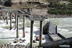 NYINGCHI, Oct. 22, 2018 -- Photo taken on Oct. 20, 2018 shows the Dalin bridge damaged by rush of water from a landslide-caused barrier lake on the Yarlung Tsangpo River in Menling County, southwest China`s Tibet Autonomous Region. Water levels are dropping after an overflow at a barrier lake formed after a landslide in the Yarlung Tsangpo River in southwest China`s Tibet Autonomous Region, local officials said Friday. TO GO WITH: Water level in Tibet barrier lake drops after overflow. (Xinhua/Chogo)