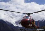 Oct. 22, 2018 -- A helicopter carries relief materials for the lanslide-caused barrier lake disaster area in Menling County, southwest China`s Tibet Autonomous Region, on Oct. 20, 2018. A helicopter from Xilin Fengteng General Aviation Co., Ltd. took part in the disaster relief to transport relief materials. The barrier lake was formed near a village in Menling County after landslides on Wednesday and Thursday blocked the Yarlung Tsangpo River`s waterway. (Xinhua/Purbu Zhaxi)