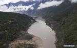 Oct. 22, 2018 -- Aerial photo taken on Oct. 20, 2018 shows the Yarlung Tsangpo River after an overflow from a landslide-caused barrier lake on the river in Menling County, southwest China`s Tibet Autonomous Region. Water levels are dropping after an overflow at a barrier lake formed after a landslide in the Yarlung Tsangpo River in southwest China`s Tibet Autonomous Region, local officials said Friday. (Xinhua/Purbu Zhaxi)