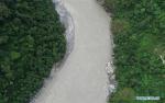 Oct. 23, 2018 -- Aerial photo taken on Oct. 20, 2018 shows the Medog section of the Yarlung Tsangpo River after an overflow in Nyingchi, southwest China`s Tibet Autonomous Region. According to local authority, water levels of the landslide-caused barrier lake on the Yarlung Tsangpo River dropped 56 meters while the risks of flood reduced. (Xinhua/Liu Dongjun)