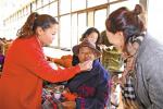 Dec. 29, 2018 -- The staff of a centralized support center for households enjoying the five guarantees are looking after the elderly who have mobility problems. [China Tibet News/Li Zhou]