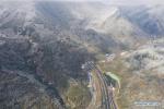 Jan. 1, 2019 -- Aerial photo taken on Dec. 30, 2018 shows the entrance of the Erlang mountain tunnel on the Ya`an-Kangding expressway in southwest China`s Sichuan Province. An expressway linking Ya`an and Kangding in southwest China`s Sichuan Province went into trial operation Monday morning, marking the total length of expressways in the province at 7,238 km. The construction of the expressway was completed nine months ahead of schedule. It will be the second highway into the Ganzi Tibetan Autonomous Prefecture of Sichuan after the National Highway 318, which leads to Lhasa, capital of Tibet Autonomous Region, said the provincial department of transportation. The newly completed route will enable passengers to travel from Chengdu to Kangding, capital of Ganzi, in only three and a half hours. (Xinhua/Jiang Hongjing)