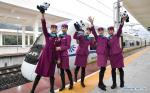 Jan. 2, 2019 -- The train conductors pose for photos before the bullet train of Chengdu-Ya`an high-speed railway at Ya`an station in Ya`an, southwest China`s Sichuan Province, on Dec. 28, 2018. The newly-built Chengdu-Ya`an railway started operation on Friday. [Photo/Xinhua]