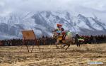 Jan. 7, 2019 -- An archer shoots on horseback in an equestrian event in Jiangjiao Village of Lhasa, capital of southwest China`s Tibet Autonomous Region, Feb. 25, 2018. Amazing shots of Tibet in 2018 are seen through lenses of Xinhua photographers. (Xinhua/Jigme Dorje)