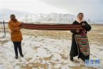 Jan. 15, 2019 -- Female workers show their weaved products at the traditional Tibetan handcraft cooperative in Xiangmao Township of Nagqu City, southwest China’s Tibet Autonomous Region. (Xinhua/Liu Dongjun)