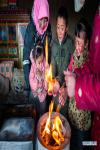Feb. 1, 2019 -- Herdswoman Qimei and her family are seen at a herdsman resettlement site in Bange County, southwest China`s Tibet Autonomous Region, Jan. 17, 2019. In the past, herdsmen in Tibet endured a ridiculously long, cold winter from October to the end of June, before moving to the summer meadow. They had no fixed residence and migrated when the seasons changed, taking their tents, kitchen utensils and other necessities on horseback. Nowadays, most herdsmen benefit from local resettlement program. They said goodbye to their winter hovels and moved into brick-and-mortar Tibetan-style homes. (Xinhua/Purbu Zhaxi) 