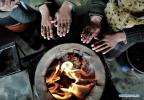Feb. 1, 2019 -- Herdswoman Qimei and her family warm themselves at a herdsman resettlement site in Bange County, southwest China`s Tibet Autonomous Region, Jan. 17, 2019. In the past, herdsmen in Tibet endured a ridiculously long, cold winter from October to the end of June, before moving to the summer meadow. They had no fixed residence and migrated when the seasons changed, taking their tents, kitchen utensils and other necessities on horseback. Nowadays, most herdsmen benefit from local resettlement program. They said goodbye to their winter hovels and moved into brick-and-mortar Tibetan-style homes. (Xinhua/Purbu Zhaxi) 