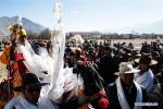 A man is awarded after winning in a horse race in Lhasa, capital of southwest China`s Tibet Autonomous Region, Feb. 7, 2019. Since 1990, horses have been drifting away from plateau life, as most villages are connected to modern road networks these days. In some places, however, horses have regained their status as a mode of transport. Gyumey Dorje lives at the foot of Mt. Gang Rinpoche, a sacred mountain for Tibetans and a hot tourist attraction. There, villagers offer tourists services such as horseback riding or transferring goods up and down the mountain. `The horse is no common livestock,` said Ngawang Tenzin from the local culture authority. `The changing status of horses reflects the development of Tibet.` (Xinhua/Purbu Zhaxi)