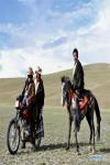 A horse is seen beside a motorbike in southwest China`s Tibet Autonomous Region, Feb. 18, 2018. Since 1990, horses have been drifting away from plateau life, as most villages are connected to modern road networks these days. In some places, however, horses have regained their status as a mode of transport. Gyumey Dorje lives at the foot of Mt. Gang Rinpoche, a sacred mountain for Tibetans and a hot tourist attraction. There, villagers offer tourists services such as horseback riding or transferring goods up and down the mountain. `The horse is no common livestock,` said Ngawang Tenzin from the local culture authority. `The changing status of horses reflects the development of Tibet.` (Xinhua/Zhou Jianwei)