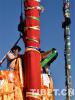 Feb. 13, 2019 -- The workers are changing prayer flags for the five pillars in front of Jokhang Temple in Lhasa, capital of Tibet Autonomous Region. 