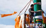 Feb. 13, 2019 -- The workers are changing prayer flags for the five pillars in front of Jokhang Temple in Lhasa, capital of Tibet Autonomous Region.