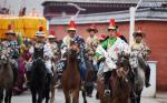 Feb. 18, 2019 -- A horse team opens a way for the annual `sunning of the Buddha` ceremony of Labrang Monastery in Xiahe County, northwest China`s Gansu Province, on Feb. 17, 2019. The annual `sunning of the Buddha` is one of the most important ceremonies at Labrang in Xiahe County, which is regarded as a top Tibetan Buddhism educational institution in China. The ceremony is held each year on the 13th day of the first lunar month. It also attracted crowds of tourists. Built in 1709, Labrang Monastery is one of the six great monasteries of the Gelug Sect of Tibetan Buddhism. (Xinhua/Chen Bin)