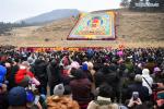 Feb. 18, 2019 -- Photo shows the scene of the annual `sunning of the Buddha` ceremony of Labrang Monastery in Xiahe County, northwest China`s Gansu Province, on Feb. 17, 2019. The annual `sunning of the Buddha` is one of the most important ceremonies at Labrang in Xiahe County, which is regarded as a top Tibetan Buddhism educational institution in China. The ceremony is held each year on the 13th day of the first lunar month. It also attracted crowds of tourists. Built in 1709, Labrang Monastery is one of the six great monasteries of the Gelug Sect of Tibetan Buddhism. (Xinhua/Chen Bin)