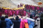 Feb. 18, 2019 -- Lamas of the Labrang Monastery shoulder the huge thangka scroll painting bearing the image of the Buddha back to the Labrang Monastery after the annual `sunning of the Buddha` ceremony in Xiahe County, northwest China`s Gansu Province, on Feb. 17, 2019. The annual `sunning of the Buddha` is one of the most important ceremonies at Labrang in Xiahe County, which is regarded as a top Tibetan Buddhism educational institution in China. The ceremony is held each year on the 13th day of the first lunar month. It also attracted crowds of tourists. Built in 1709, Labrang Monastery is one of the six great monasteries of the Gelug Sect of Tibetan Buddhism. (Xinhua/Chen Bin)