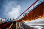 Feb. 18, 2019 -- People replace prayer flags in southwest China`s Tibet Autonomous Region, Feb. 6, 2019. The Tibetan New Year, known as Losar, is the most important festival in the Tibetan calendar. This year`s Losar fell on Feb. 5 and coincided with the Spring Festival. Losar is a time for family reunions. It is marked by religious rituals, long prayers, horse racing, family gatherings and feasts. As the festival draws near, people go shopping, do some cleaning and decorate their folk houses. Families feast on Tibetan food. Women make Kharbse, a popular dish made from flour and yak butter, and guthuk, a traditional snack similar to a dumpling. People plant their own highland barley, which is believed to indicate the harvest in the following year. On the altar in the living room there are placed, a pastry in the shape of a sheep head, a pot of highland barley, dates, air-dried beef, candies, nuts, butter, and brown sugar, presented to pray for prosperity and good weather for crops. In Tibetan `sheep head` is pronounced similarly to `the year`s beginning` thus making it an auspicious symbol. Guthuk are sometimes filled with `surprises` including charcoal, wool or chillies. Someone who receives a guthuk filled with wool is described as being `good-natured`, while coins or wheat mean good fortune. The food is washed down with highland barley liquor. Celebrations of the Tibetan New Year usually last for 15 days. Local people also participate in activities including Tibetan opera performance, folk dancing, archery and wrestling. (Xinhua/Purbu Zhaxi)