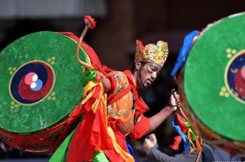 Tibetan Buddhist monks perform during Cham dance ritual